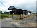 SO8752 : Dutch barn, Church Farm, Whittington by Chris Allen