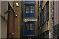 View of an old business sign in Mills Court off Curtain Road