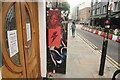 View of street art on the side of the building next to Shoreditch Masjid on Redchurch Street