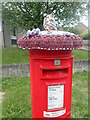 Pillar box with a hat