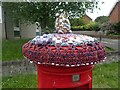 Pillar box with a hat