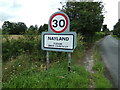 TL9734 : Nayland Village Name sign by Geographer