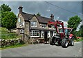 "The Red Lion" and a passing tractor in Waterfall