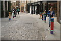 View of brightly painted bollards on Floral Street #7