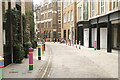 View of brightly painted bollards on Floral Street #7