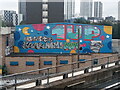 View of a 1UP London Mural Festival mural on Gibbins Road from the high-level DLR platform of Stratford Station