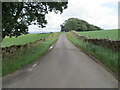 Wall enclosed minor road heading towards Wyebourne