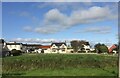 Houses lining the main street through Carrutherstown