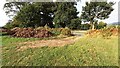 Pile of soil beside field gateway on SW side of road at Eden Brows