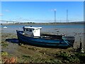 TQ9168 : Derelict boat on The Swale by Marathon