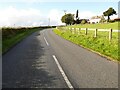 Minor road passing a farm