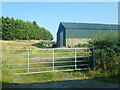 Farm shed alongside the B180 close to the Fofanny Crossroads