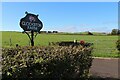 Clockston Farm sign and pasture