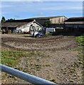 Farm buildings set back from High Street, Arlingham