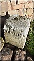 Benchmark on boundary stone at cross roads at Barrock End Cottages