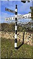 Cumberland County Council signpost at crossroads near Barrock End Cottages