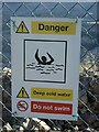 SS8380 : Danger notice on boundary fence, Cornelly Quarry by eswales