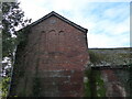 Gable end of an old stone barn at Broomfields Farm