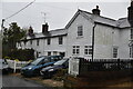 Row of weatherboarded cottages, Three Leg Cross