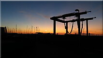 SY6874 : By Portland Marina, Fortuneswell - silhouette of boat lifting gear by Colin Park