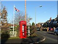 SK6037 : Telephone kiosk and fingerpost by Alan Murray-Rust