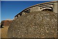TM2831 : Landguard Fort: looking up to the fort from the moat by Christopher Hilton
