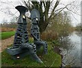 SY7891 : Sculpture by the lakes - Watchers by the lake by Rob Farrow
