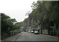 Cottages  under  cliff  and  A623  through  Middleton  Dale