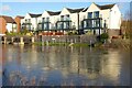 Apartments reflected in a flooded Mill Avon