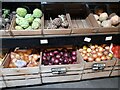 TQ2688 : Vegetables outside Bekems Superstore, Hampstead Garden Suburb by David Howard