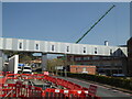 SO8754 : Worcestershire Royal Hospital - link bridge and a big crane by Chris Allen