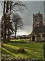 SU1590 : Evening sun and rain clouds over St. Leonard's churchyard by Gareth James