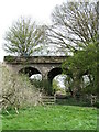 Old railway bridge with greenhouse