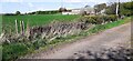 Northern parapet of Plump Bridge beside old road at approach to Plumpe Farm