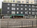 Shops and flats opposite the Royal Docks Academy