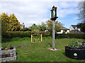 TM5197 : Blundeston village sign and flower beds by Adrian S Pye
