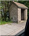 Stone bus shelter alongside the B4293 south of Mitchel Troy