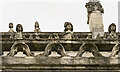 SE6132 : Heads on Selby Abbey roof by Julian P Guffogg