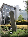 Stone column in front of Osbourne Clarke