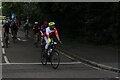 View of cyclists in the RideLondon event turning the corner from Broadmead Road into High Road Woodford Green #10