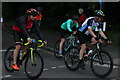 View of cyclists in the RideLondon event turning the corner from Broadmead Road into High Road Woodford Green #12