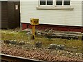 Huntly signal box (detail) and milepost