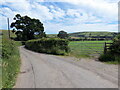 Llwybr yn gadael yr heol / Path exits the road