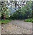 Red phonebox at a bend in the road, Penallt