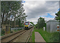 Fulbourn: an Ipswich train nearing Teversham Road crossing