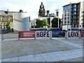 Banner for Little Amal in Millennium Square