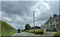 Houses and farm buildings on the A487, looking east