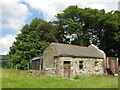 Outbuildings to the rear of the old cottage near Poperd Hill