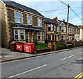 Two red Biffa wheelie bins, High Street, Pentwynmawr