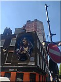 TQ3282 : Wall paintings old and new on the corner of Whitecross Street and Old Street by Martyn Pattison
